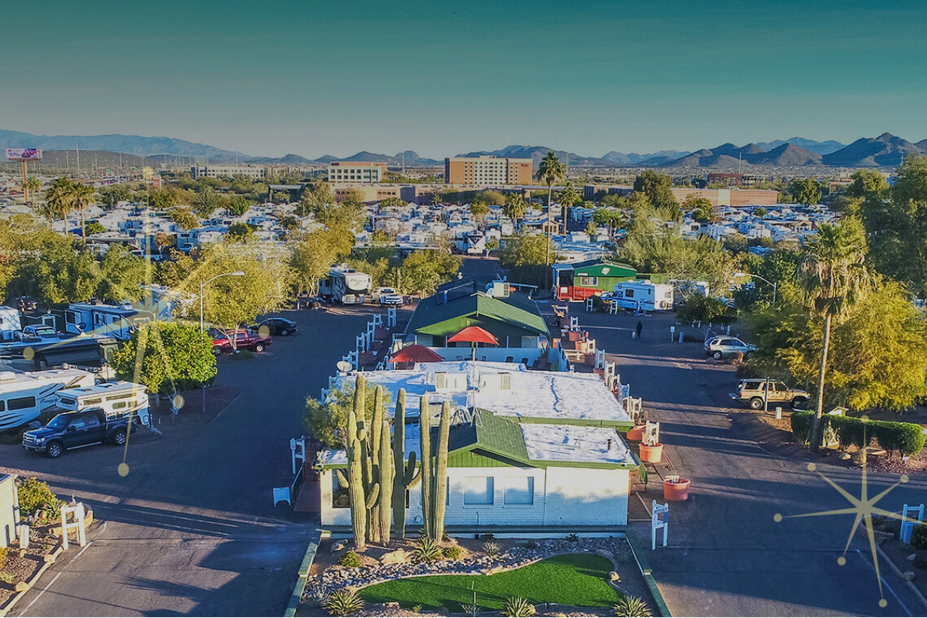 Aerial view of Desert's Edge RV Village showing RV sites, pool and amenity buildings in Phoenix