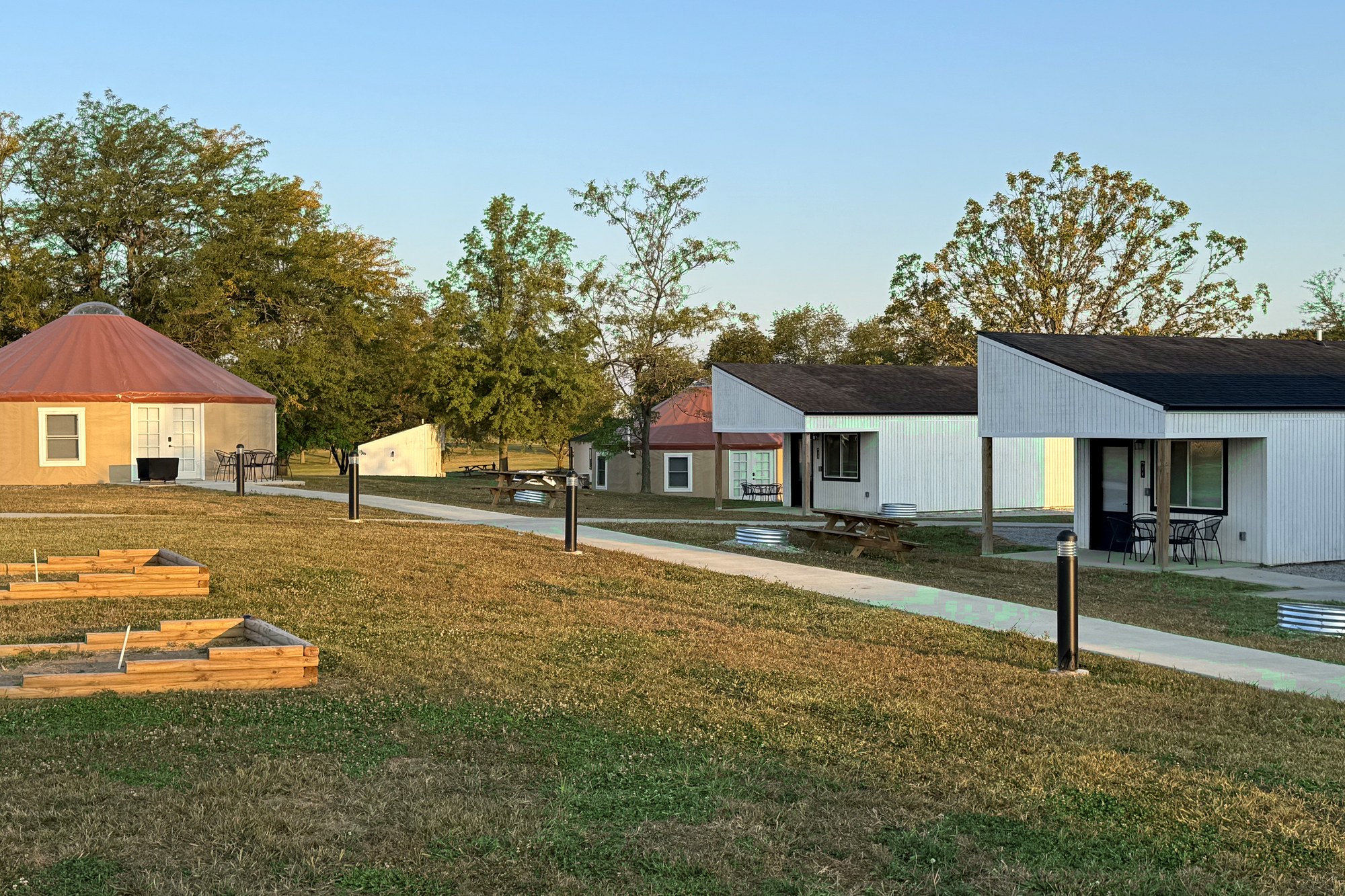 Park-model cabins and yurts on mowed lawn at Haven Hills Campground & Resort in Illinois